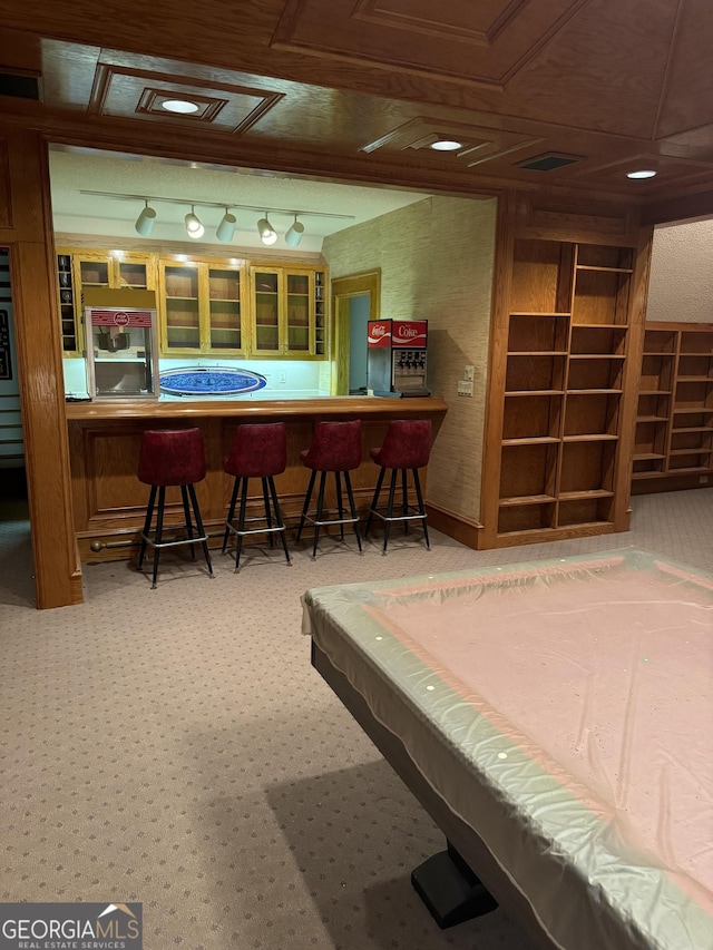 playroom with a dry bar and visible vents