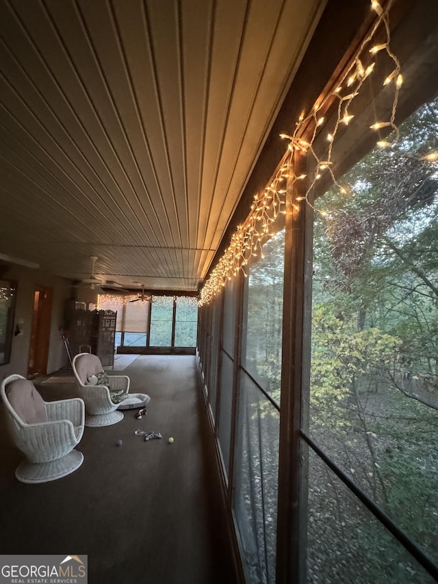 unfurnished sunroom with wood ceiling