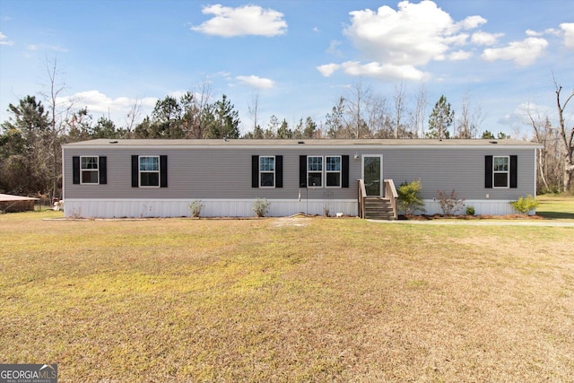 manufactured / mobile home with a front lawn