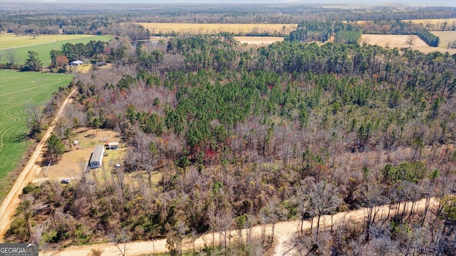 birds eye view of property with a rural view