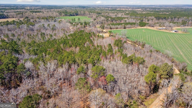 birds eye view of property with a wooded view