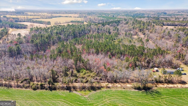 bird's eye view featuring a forest view