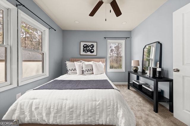 bedroom with carpet flooring, ceiling fan, and baseboards