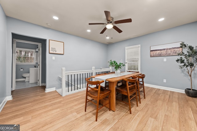 dining room with baseboards, ceiling fan, light wood finished floors, and recessed lighting