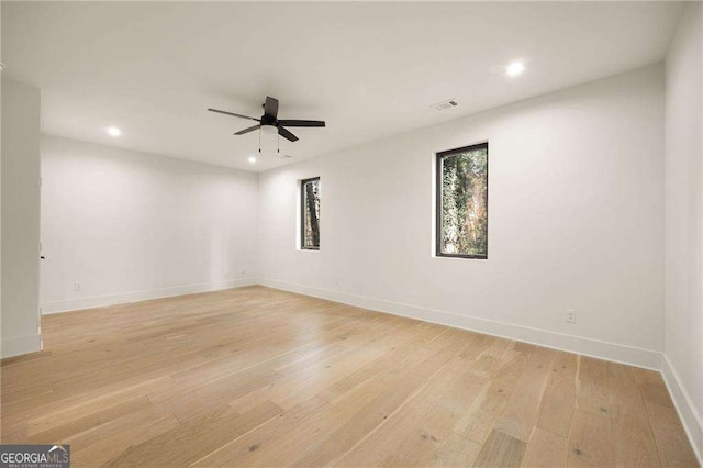 unfurnished room featuring ceiling fan, recessed lighting, light wood-style flooring, and baseboards