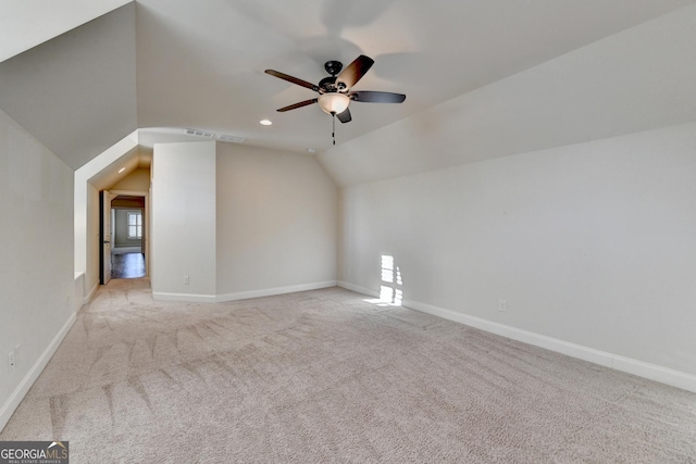 additional living space featuring recessed lighting, light carpet, vaulted ceiling, ceiling fan, and baseboards