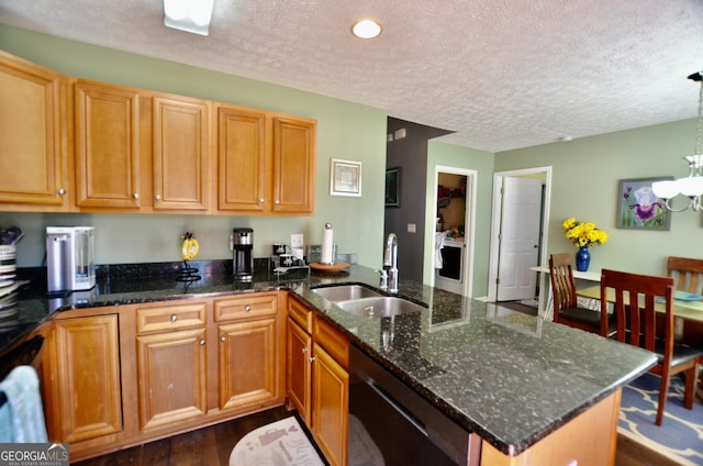 kitchen featuring black dishwasher, an inviting chandelier, dark wood-type flooring, a sink, and a peninsula