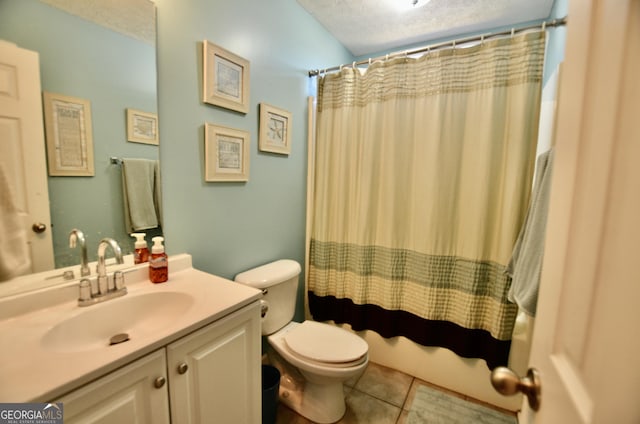 full bathroom with a textured ceiling, vanity, toilet, and tile patterned floors