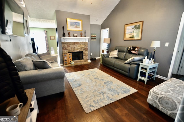 living area featuring a fireplace, vaulted ceiling, baseboards, and wood finished floors