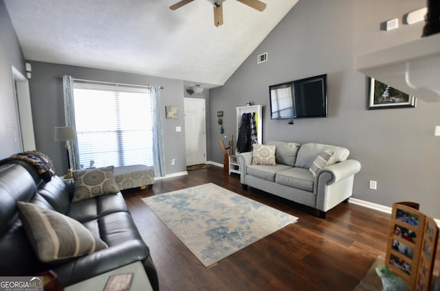 living room featuring visible vents, ceiling fan, baseboards, and wood finished floors