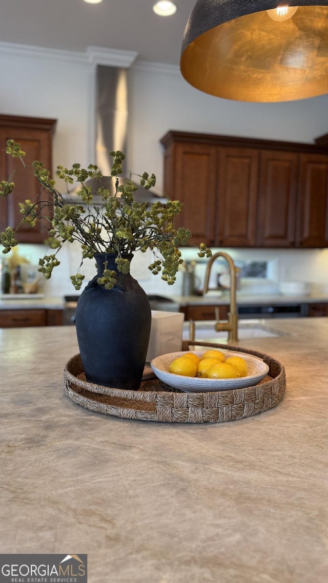 room details with a sink and ornamental molding