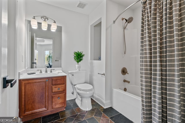 bathroom featuring visible vents, baseboards, toilet, vanity, and shower / bathtub combination with curtain