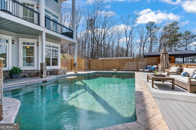 view of pool with fence and a fenced in pool
