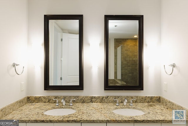 bathroom featuring double vanity and a sink