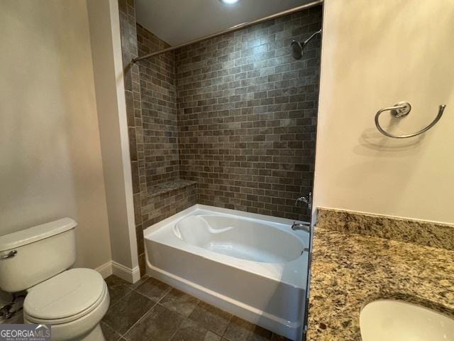 bathroom featuring toilet, baseboards, washtub / shower combination, and tile patterned floors