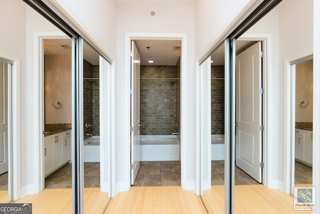 corridor with light tile patterned floors