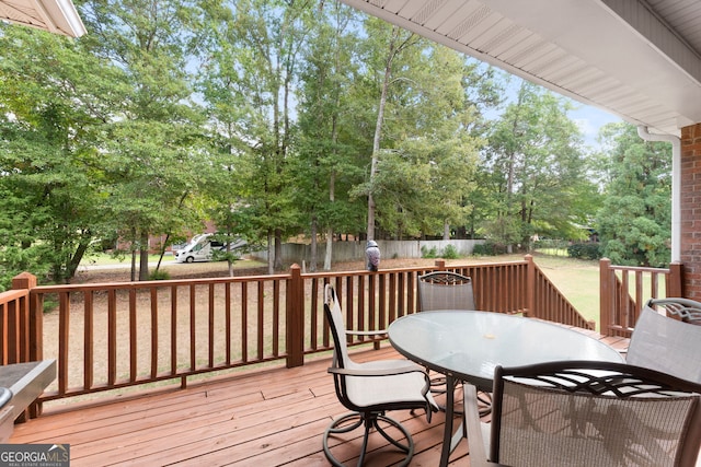 wooden deck featuring outdoor dining area