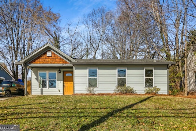 view of front of property with a front lawn