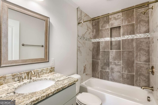 bathroom featuring toilet, vanity, and bathtub / shower combination