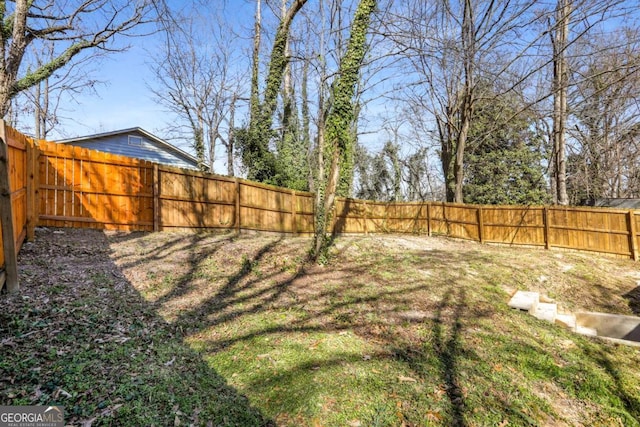 view of yard featuring a fenced backyard