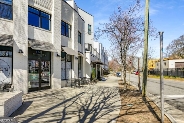 exterior space featuring sidewalks and a residential view