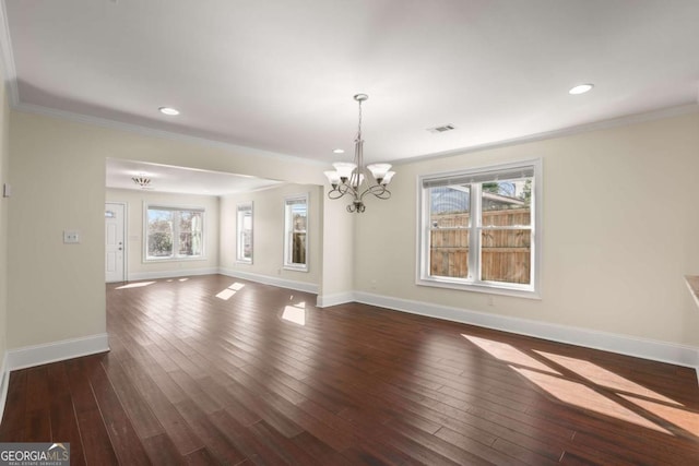 unfurnished dining area featuring a notable chandelier, dark wood-style floors, baseboards, and ornamental molding