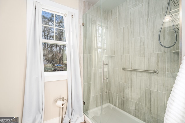 full bath featuring a shower stall