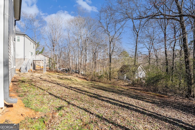 view of yard featuring stairs