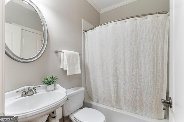 full bathroom with crown molding, shower / tub combo, a sink, and toilet