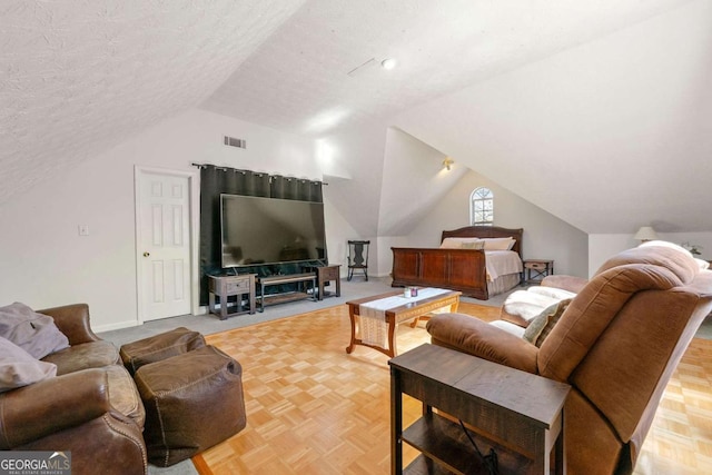 living room with lofted ceiling, baseboards, visible vents, and a textured ceiling