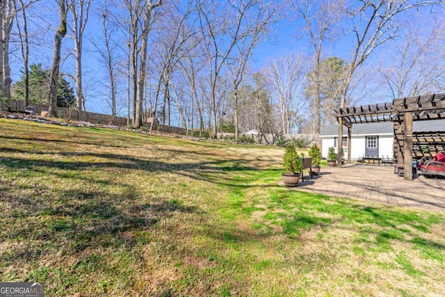 view of yard with a patio area, fence, and a pergola