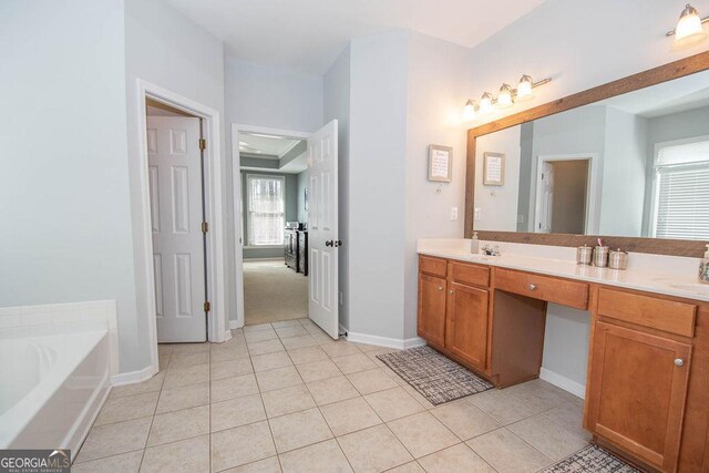 bathroom with double vanity, a bath, and tile patterned floors