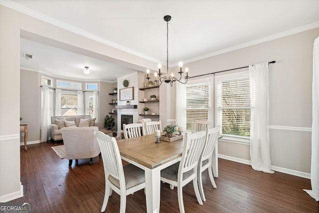 dining area featuring plenty of natural light, dark wood-type flooring, and crown molding