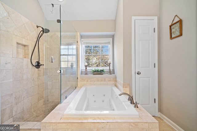 full bathroom with baseboards, tiled shower, and a tub with jets