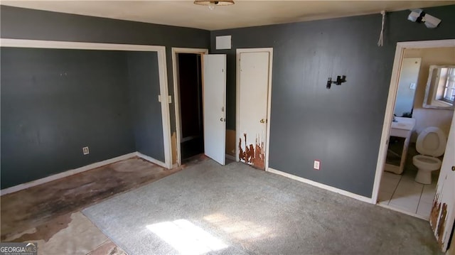 unfurnished bedroom with baseboards