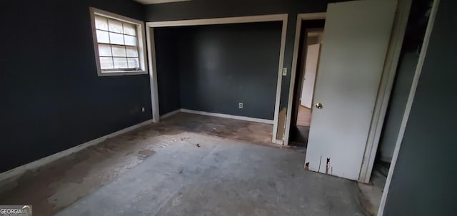 unfurnished bedroom with baseboards