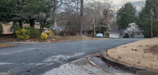 view of street featuring curbs