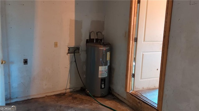 utility room featuring water heater