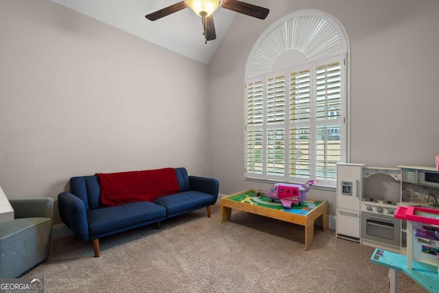 game room with carpet floors, vaulted ceiling, and ceiling fan