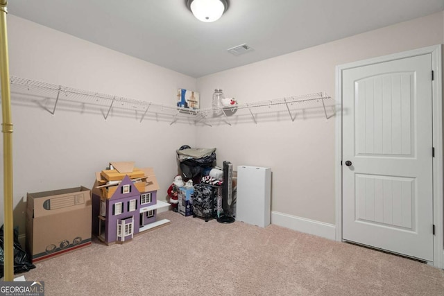 walk in closet featuring carpet flooring and visible vents