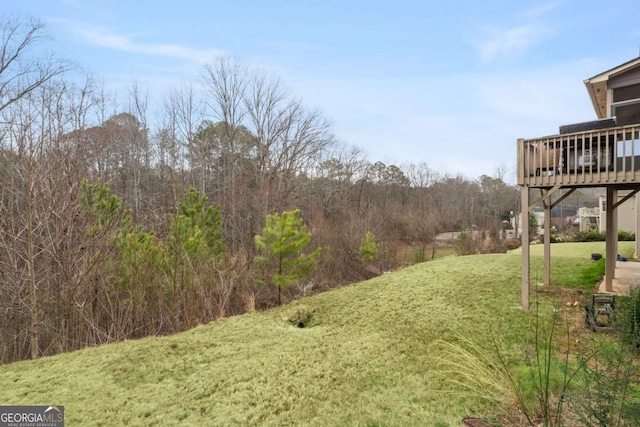 view of yard featuring a wooden deck