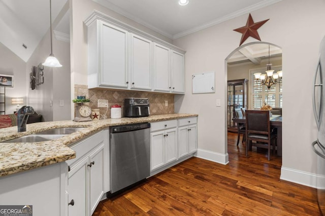 kitchen featuring tasteful backsplash, coffered ceiling, dark wood finished floors, stainless steel appliances, and a sink