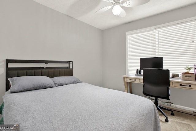 bedroom featuring lofted ceiling, carpet flooring, and ceiling fan