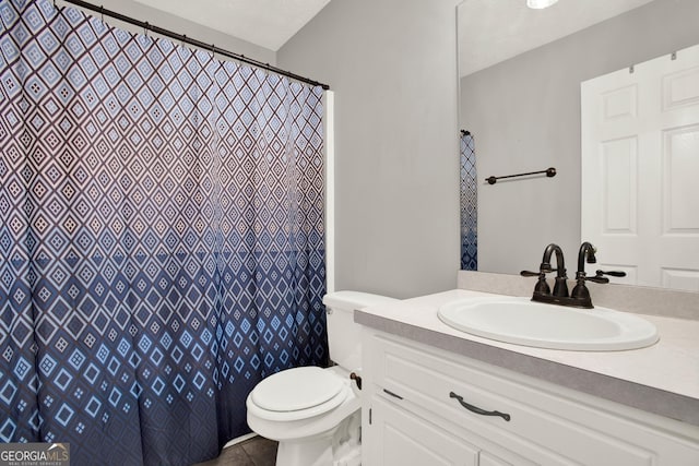 bathroom featuring a shower with curtain, vanity, toilet, and tile patterned floors