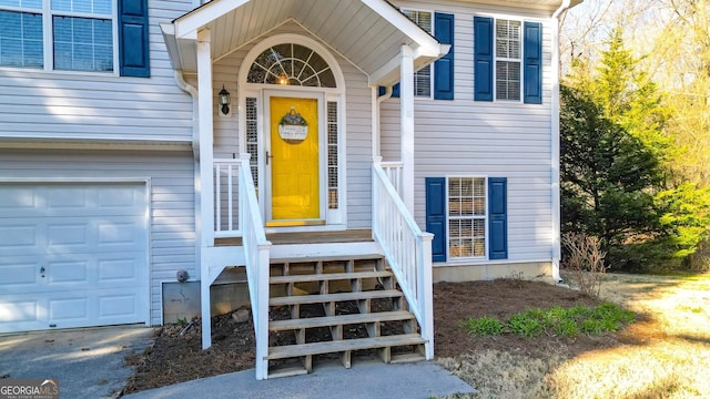 view of exterior entry featuring a garage