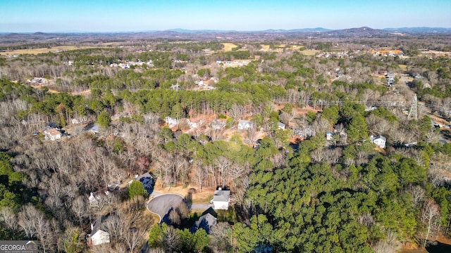 aerial view featuring a mountain view and a wooded view