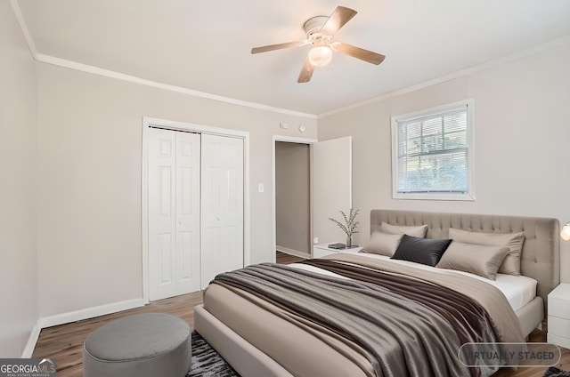 bedroom with baseboards, wood finished floors, and crown molding