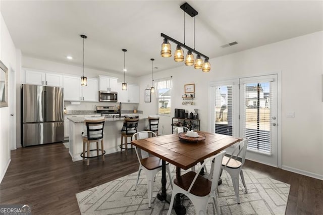 dining room featuring recessed lighting, visible vents, dark wood finished floors, and baseboards