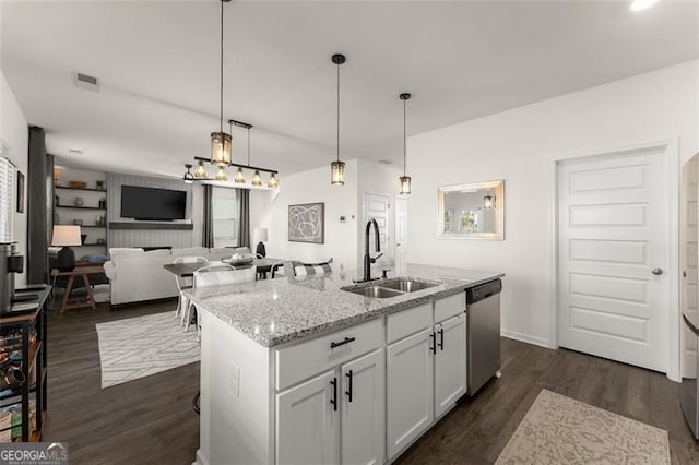 kitchen with visible vents, dishwasher, open floor plan, dark wood-type flooring, and a sink