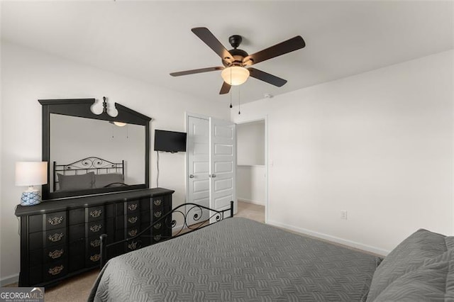 bedroom featuring carpet flooring, a ceiling fan, and baseboards